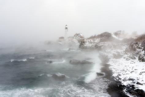 robbie-george-sea-smoke-rises-up-around-maine-s-portland-head-light-on-a-cold-winter-s-day